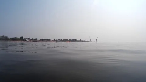 Jet ski pulls an inflatable banana - video-shooting from afar on sea Stock-Footage 125842341