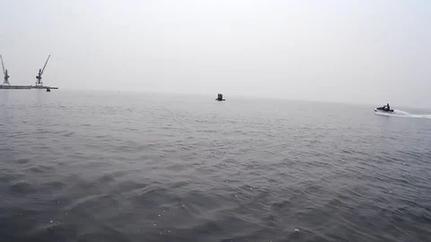 Jet ski pulls an inflatable banana at sea Stock-Footage 125842509