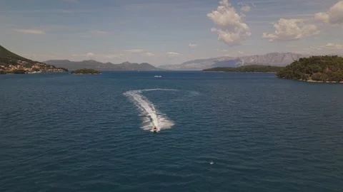 Jet Ski Racing Toward Drone Over Crystal Clear Waters of Lefkada, Greece Stock-Footage 336516726