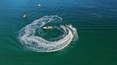 Jet Ski Rider Making Spirals In Clean Atlantic Ocean Water, Stunning Adventure Stock Footage 317901698