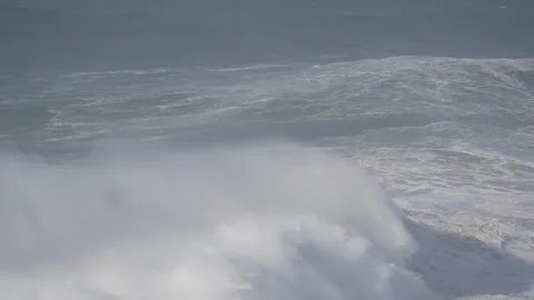 Jet Ski Rider Navigating Enormous Waves in Nazare, Portugal Surfing Adventure Stock Footage 300606198