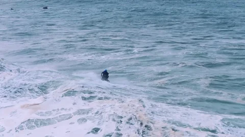 Jet Ski Rider Navigating Rough Ocean Waves Stock Footage 296696404