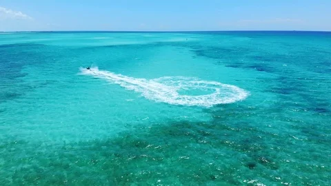 Jet ski Rider Splash Through The Sea At Fortuna Beach, Freeport Bahamas Stock Footage 108331794