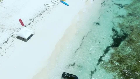 Jet Ski Rider Splashing Through Tropical Waters at Fortuna Beach, Bahamas Stock Footage 108331373