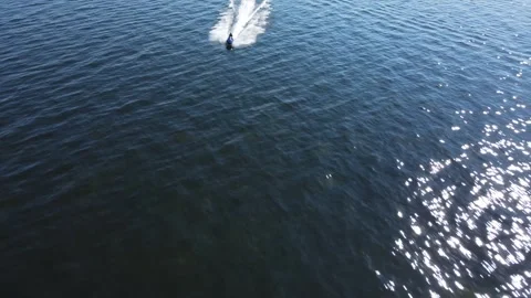 The jet ski rides on the lake. Drone footage. Water transportation. Stock Footage 295069397
