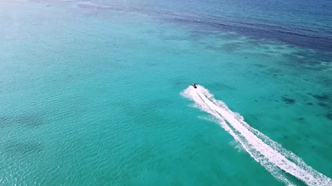 Jet Ski riding on calm waters via drone Stock Footage