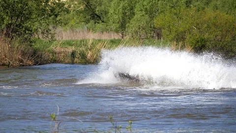 Jet ski on the river. Splashes fly apart. Stock Footage 111582833