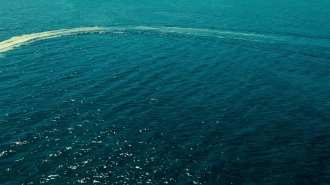 Jet Ski Speeding Across Waters at Taino Beach, Freeport Bahamas Aerial View Видео 90704960
