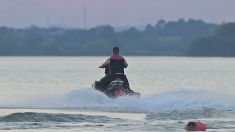 Jet Ski Speeding on Water with Spray Stock-Footage 345041280