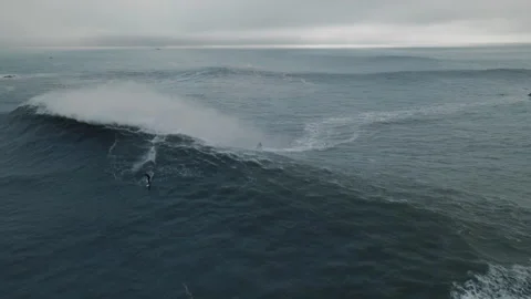 Jet ski surfer conquers massive waves at nazare beach in portugal Stock Footage 321477249