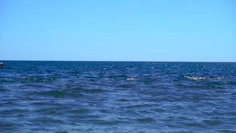 A jet ski takes turns taking catamarans to the sea Stock Footage 136331737