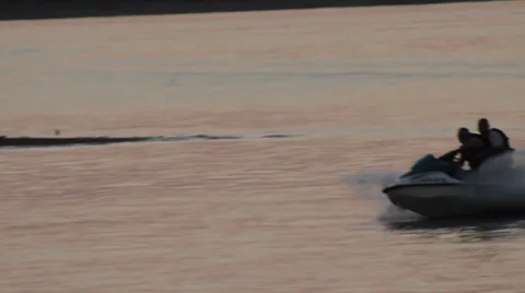 Jet Ski wave runner @ dusk Stock Footage 28499076