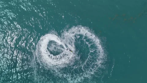 Jet Skiing In Loop shape in the Ocean Stock Footage 114576635