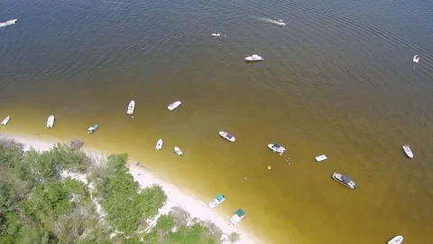 Jet skis and Boats Aerial Footage near Tropical White Sand Beach Stock Footage