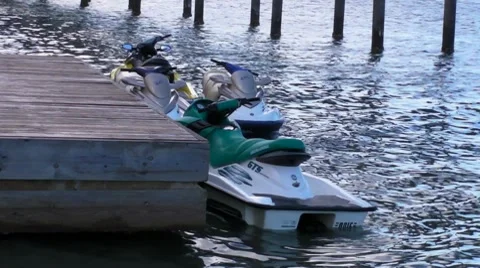 Jet Skis besides small pier Stock Footage 7765954