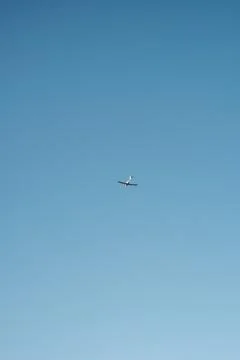 Jet Soaring Through Blue Sky Stock Photos