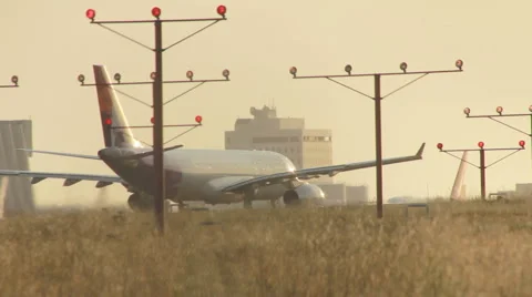 JET TAKES OFF AT SUNSET Stock Footage 2324789