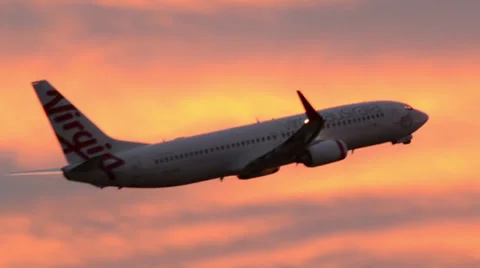Jet taking off and flying at at Sunset Virgin Australia 160GYAP 0014 NTSC Stock Footage 26476904