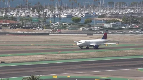 Jet taxing while small plane takes off Stock Footage 49760563