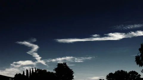 Jet trails mutating into cirrus clouds timelapse Stock Footage 36970674