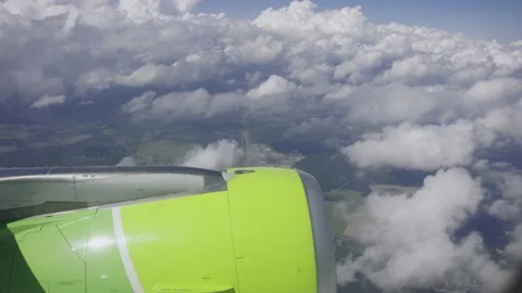 Jet turbine engine of aircraft with cloud and blue sky background.Aviation Stock Footage 235669513