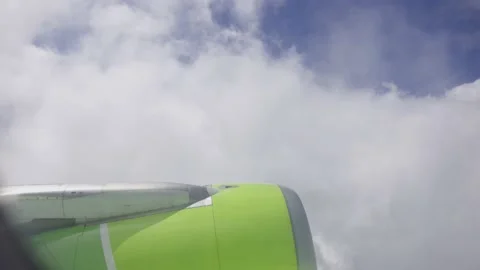 Jet turbine engine of aircraft with cloud and blue sky background.Aviation Stock Footage 235669575