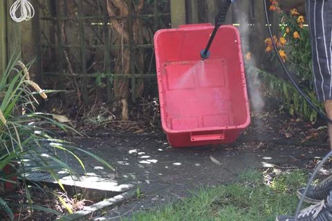 Jet washing a red box Stock Photos