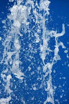 A jet of water sprayed under pressure from a fountain. Stock Photos