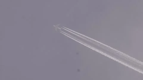 Jet white smoke while flying in the sky Stock Footage 293670347