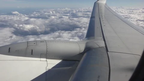 Jet wing blue sky clouds Stock Footage 72739972