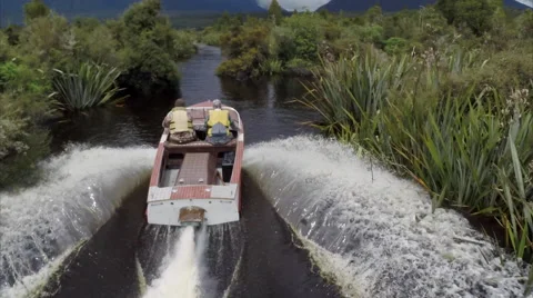 Jetboat accelerating away with camera following behind. Stock Footage 50029537