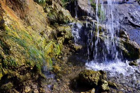 Jets of clean and cold spring water of the Plakun waterfall on the right bank Stock Photos