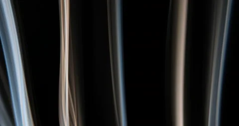 Jets of multi-colored smoke on a black background Stock Footage 234969021