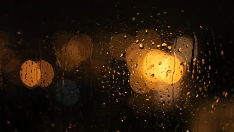 Jets Of Rain Flow Down The Window Against The Background Of Blurry Night Lights. Video stock 100383517