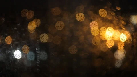 Jets Of Rain Flow Down The Window Against The Background Of Blurry Night Lights. Video stock 100384690