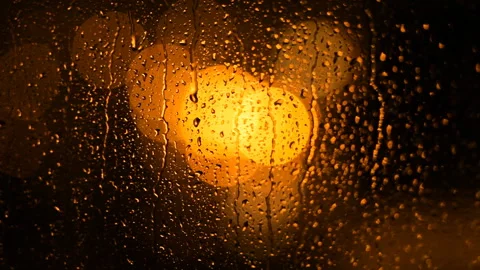 Jets Of Rain Flow Down The Window Against The Background Of Blurry Night Lights. Video stock 100385088