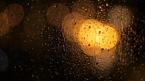 Jets Of Rain Flow Down The Window Against The Background Of Blurry Night Lights. Video stock 100385174
