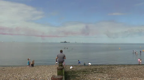 Jets trailing Red and Blue Smoke Trails at Seaside Stock Footage 67607407