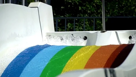 Jets of water flow down on a water slide Stock Footage 78593043
