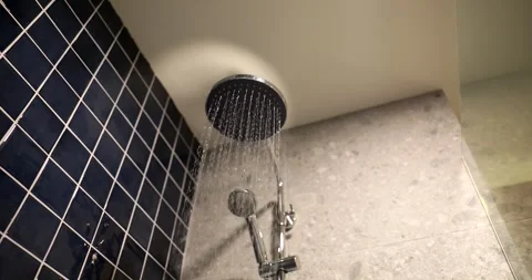 Jets of water flow from round shower head Stock Footage 270917570