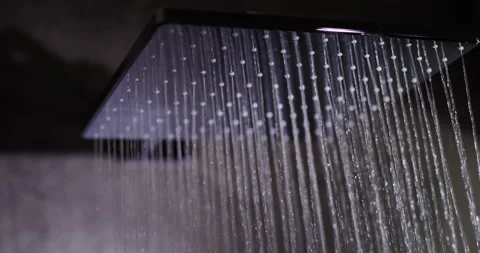 Jets of water flow from the square shower head. Elite plumbing and comfort Stock Footage 196732721