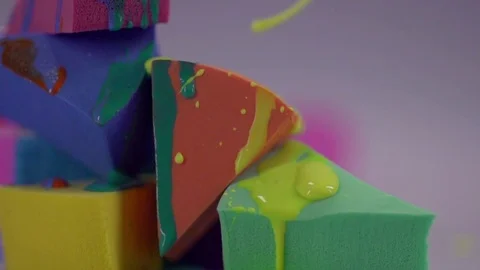 Jets of yellow nail polish fall on sponge. Stock Footage 77512139