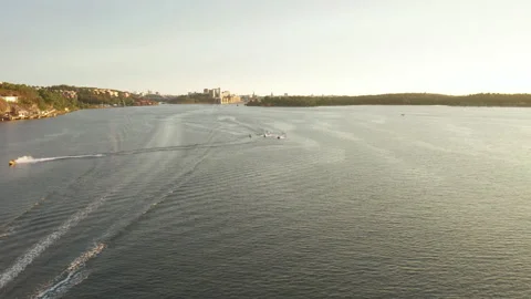 Jetski having lots of fun in the water outside of Stockholm City, aerial Stock Footage 142401459