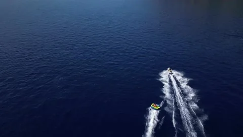 Jetski Pulling A Tube On Dark Blue Sea In Croatia 스톡 동영상 207092285