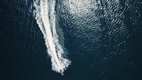 Jetski Rider Accelerating Top Down Fast Luxury Lifestyle Island Ocean Sunny Day Stock Footage 235661683