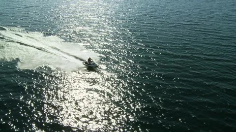 JetSki Speeds through sunny reflection Stock Footage 49401360