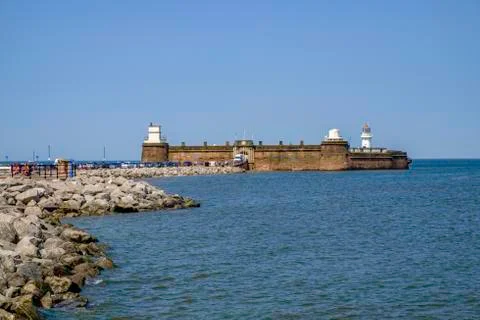 Jetty and lighthouse at New Brighton UK Stock Photos