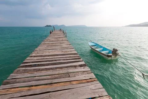 Jetty and small boat at Koh Rong island, Cambodia, South East Asia Stock Photos