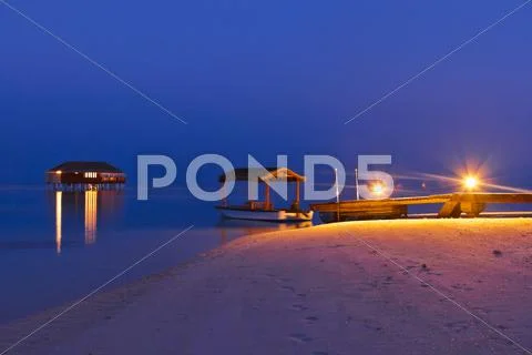 Jetty beach at sunset - Maldives Stock Photos