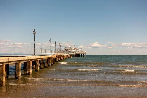 Jetty on the beach in warm sunlight Foto stock